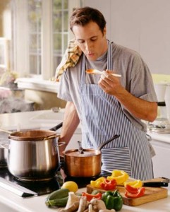 a person cooking at a stove top