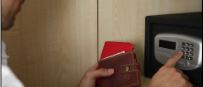 Man puts personal items in safe