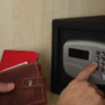 Man puts personal items in safe