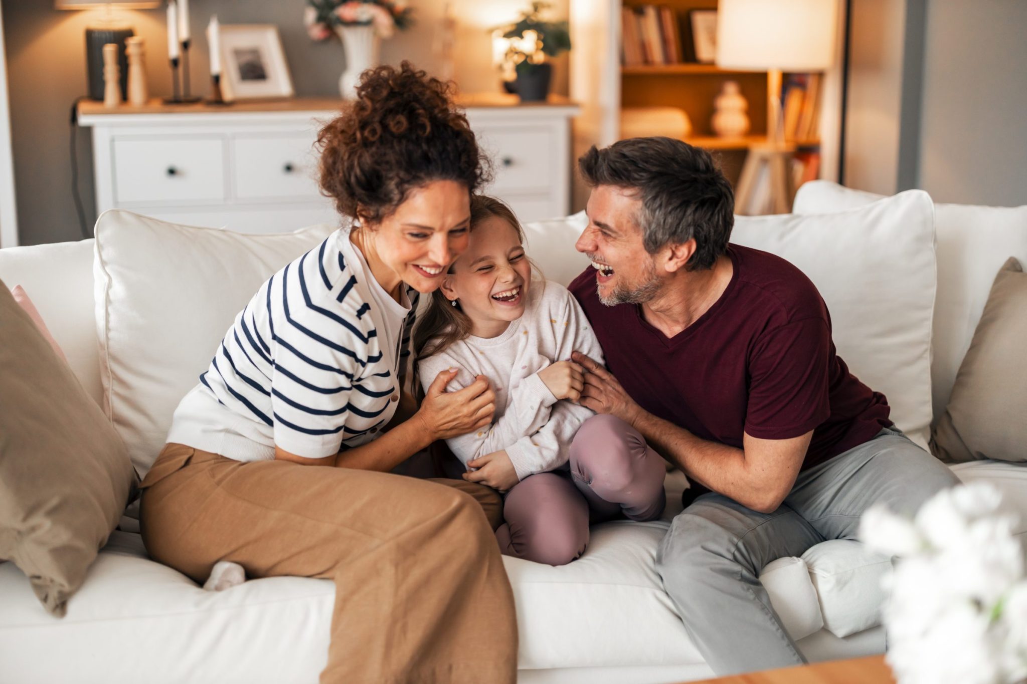 parents laughing with their child