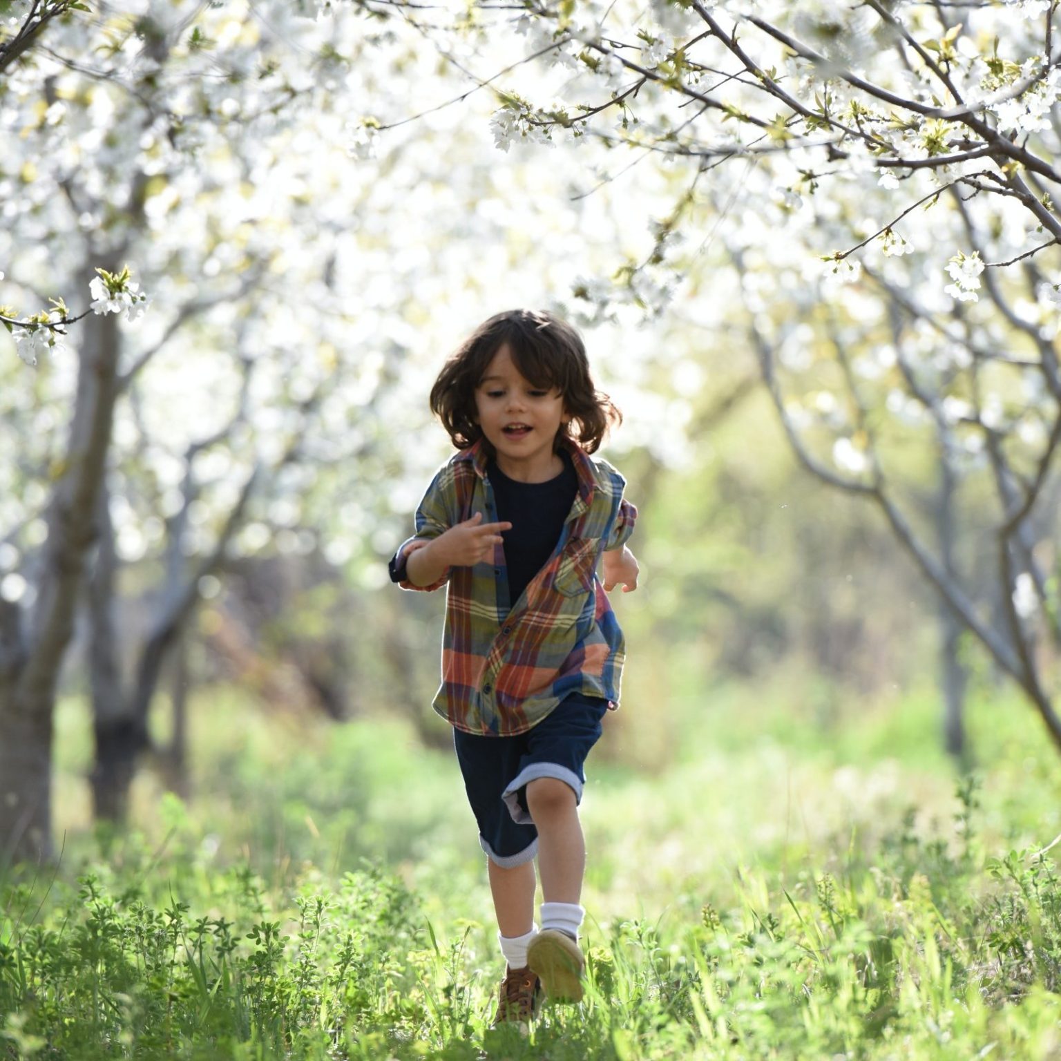 young boy running outside